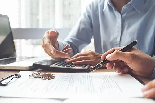 people looking at financial paperwork
